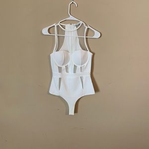 White lace detailing bodysuit in small white never worn